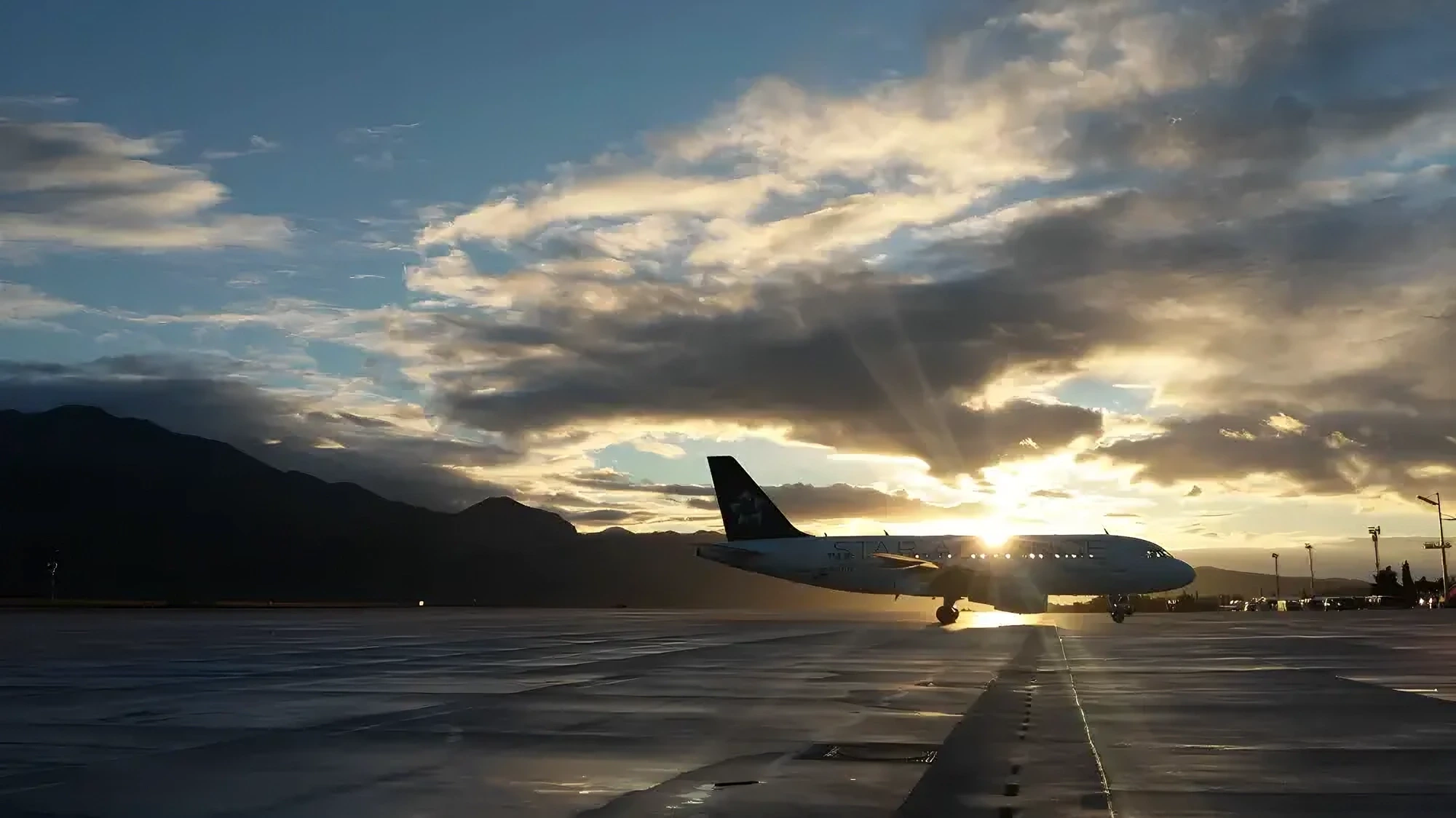 Aircraft taking off into the sunset